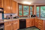 Kitchen with a lovely and serene wooded view